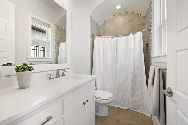 bathroom with tile patterned flooring, toilet, vanity, and a shower with shower curtain