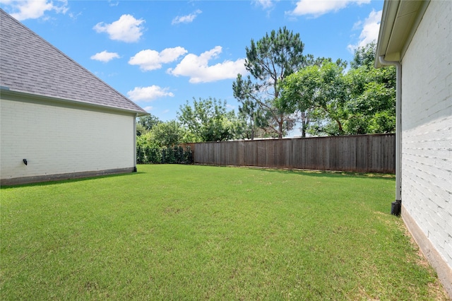 view of yard with a fenced backyard