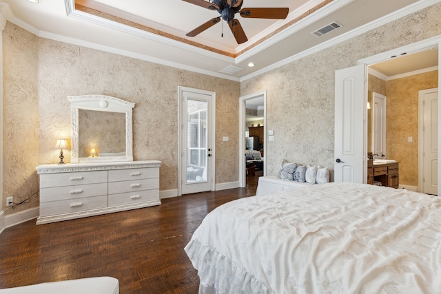 bedroom featuring crown molding, dark hardwood / wood-style floors, access to outside, and ensuite bath