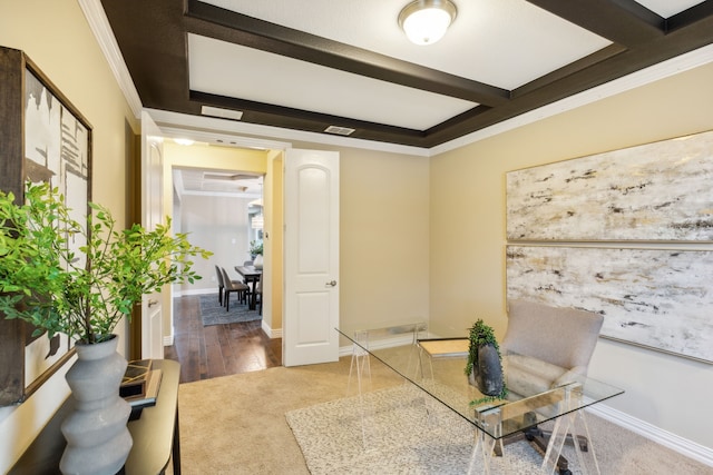 office space featuring ornamental molding and beamed ceiling