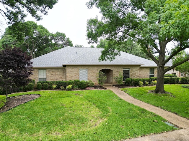 ranch-style house with a front yard