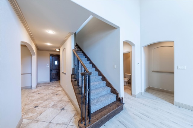 staircase with ornamental molding