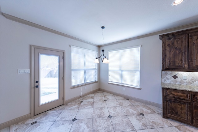 unfurnished dining area featuring light tile patterned floors, crown molding, and a notable chandelier