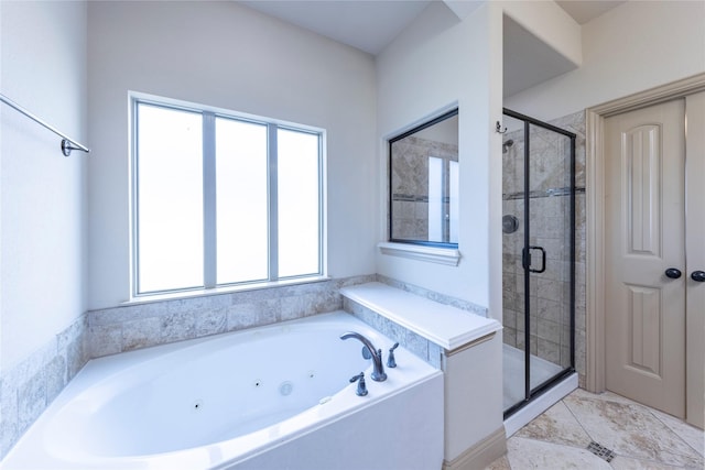 bathroom with shower with separate bathtub