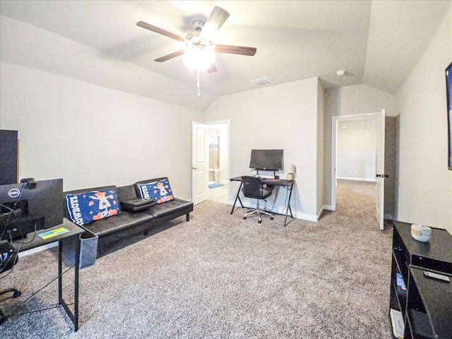 carpeted home office featuring lofted ceiling, visible vents, a ceiling fan, and baseboards