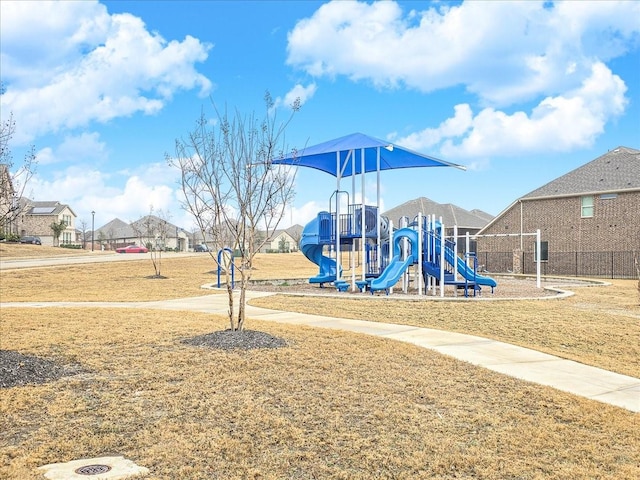 community play area featuring a lawn