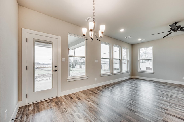 unfurnished dining area with baseboards, visible vents, wood finished floors, and recessed lighting