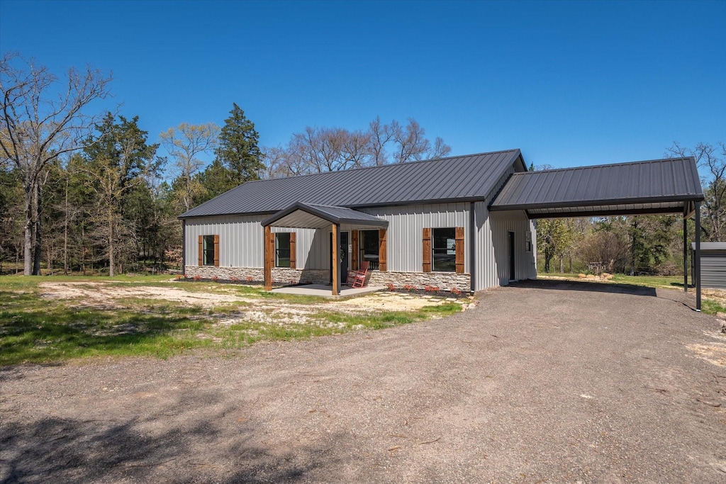 1191 Vz County Road 1207, Canton, TX 75103 - modern farmhouse style home featuring a standing seam roof, a carport, driveway, and metal roof