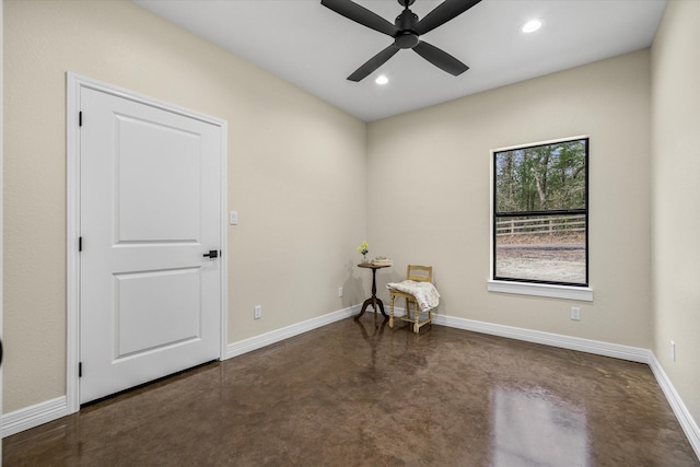 unfurnished room featuring concrete floors, recessed lighting, a ceiling fan, and baseboards