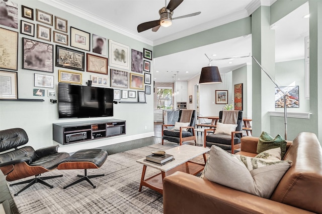 living room featuring crown molding and ceiling fan