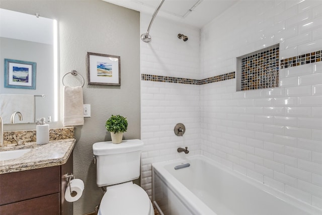 full bathroom with vanity, toilet, and tiled shower / bath combo