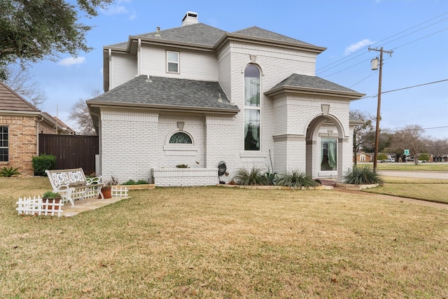 view of front facade featuring a patio and a front lawn