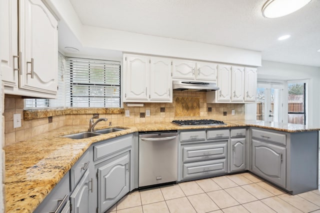 kitchen featuring appliances with stainless steel finishes, sink, gray cabinetry, and white cabinets