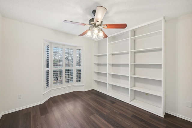 empty room featuring dark hardwood / wood-style floors and ceiling fan