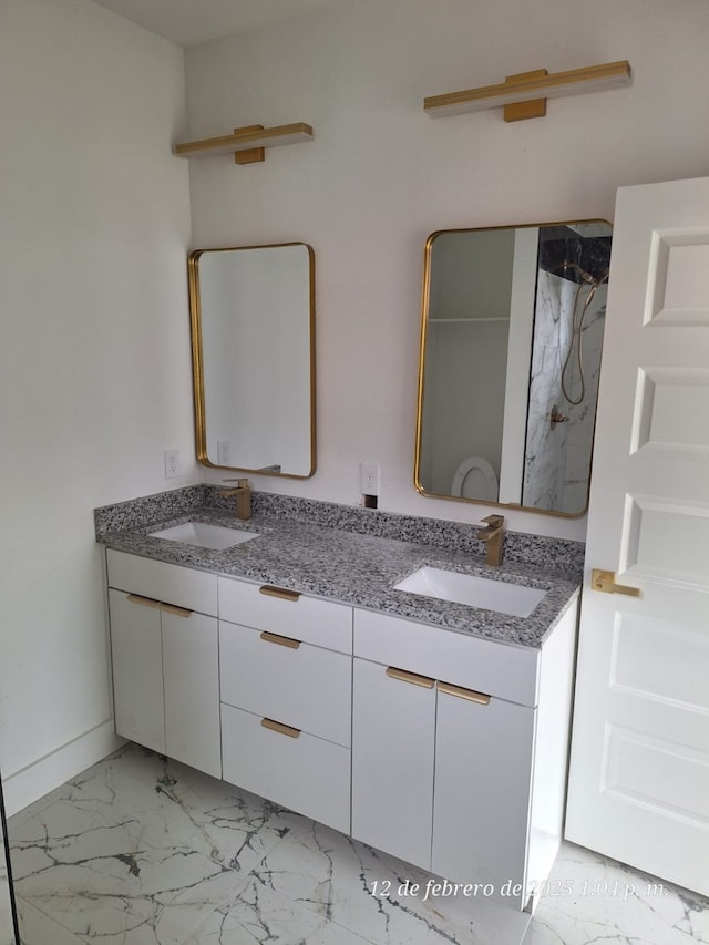 bathroom featuring vanity and a shower