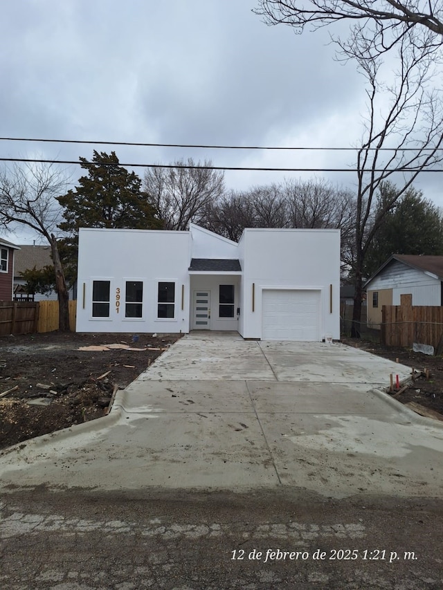 view of front of property with a garage