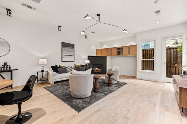 living room with light hardwood / wood-style flooring