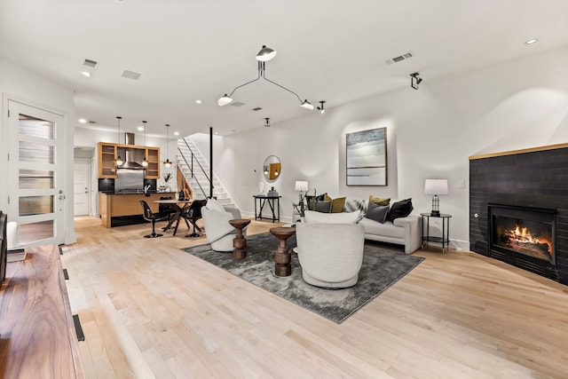 living room with light hardwood / wood-style floors