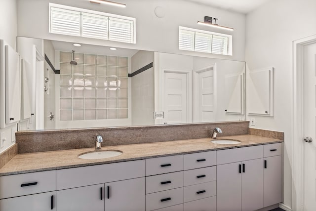 bathroom featuring vanity and a shower