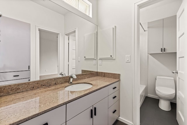 full bathroom featuring vanity, toilet,  shower combination, and tile patterned flooring