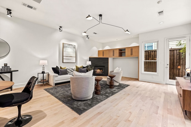 living room with light hardwood / wood-style flooring