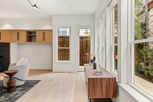 sitting room with light hardwood / wood-style flooring