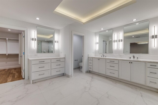 empty room featuring indoor wet bar, beverage cooler, and light hardwood / wood-style flooring