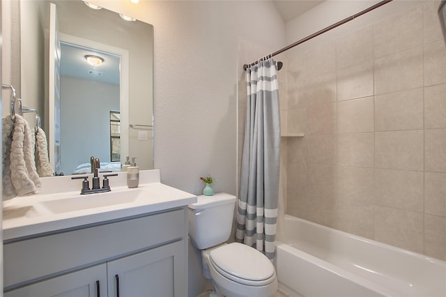 full bathroom featuring toilet, vanity, and shower / bath combo with shower curtain