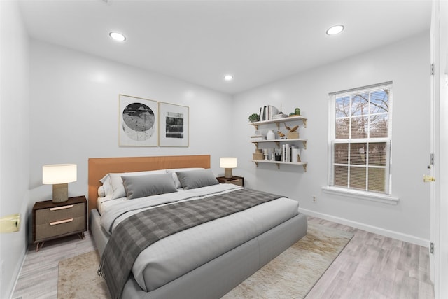 bedroom featuring recessed lighting, baseboards, and light wood-style flooring