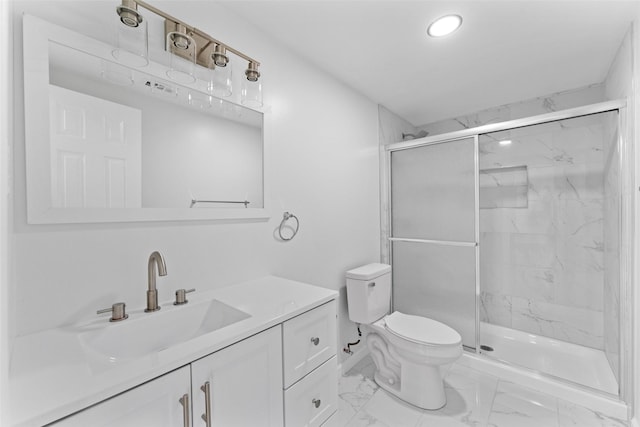 full bathroom with vanity, toilet, marble finish floor, and a marble finish shower