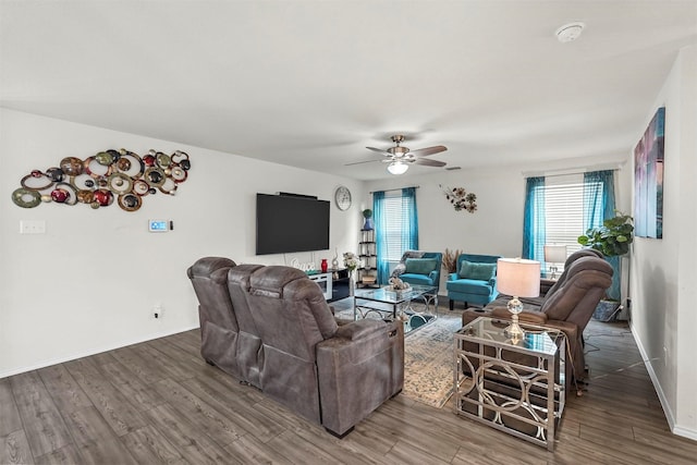 living room with hardwood / wood-style flooring and ceiling fan