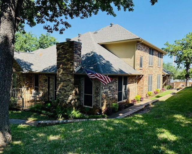 1230 Wooded Trl, Hurst, TX 76053 - rear view of house with roof with shingles, a lawn, a chimney, and brick siding