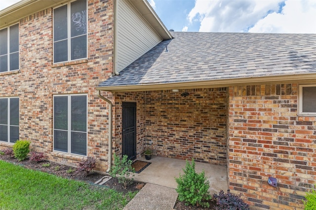 1230 Wooded Trl, Hurst, TX 76053 - entrance to property with roof with shingles and brick siding