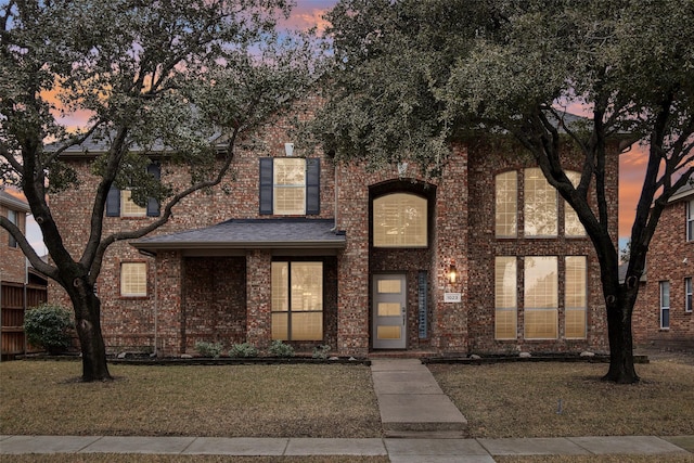 view of front of property with a lawn