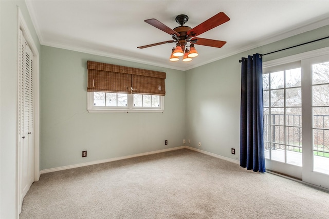 unfurnished bedroom featuring crown molding, access to outside, and light carpet