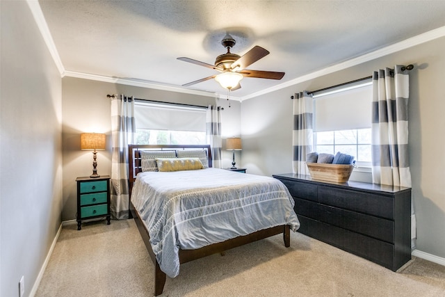 carpeted bedroom with crown molding and ceiling fan