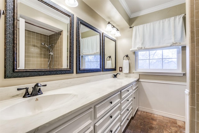 bathroom featuring crown molding and vanity