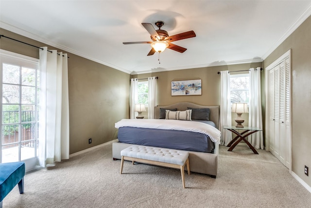 carpeted bedroom with ceiling fan, ornamental molding, and multiple windows