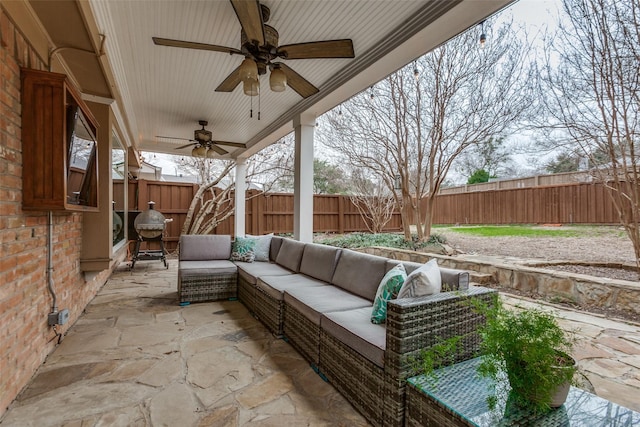 view of patio / terrace featuring an outdoor living space and ceiling fan