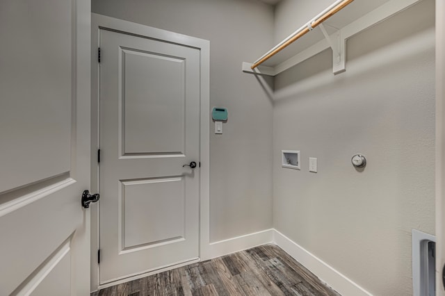 laundry room with dark hardwood / wood-style floors and washer hookup