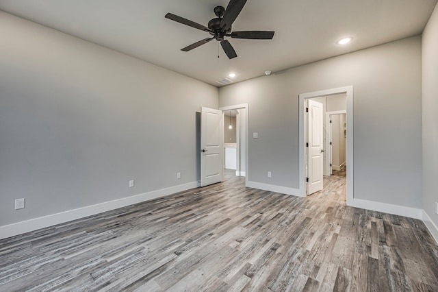 unfurnished bedroom featuring light hardwood / wood-style flooring and ceiling fan