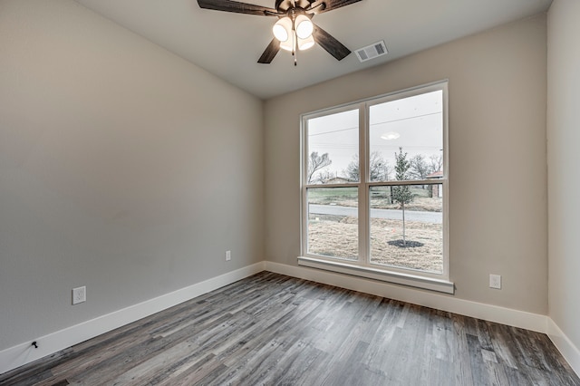 unfurnished room with hardwood / wood-style floors and ceiling fan