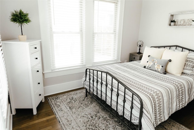 bedroom featuring dark hardwood / wood-style flooring