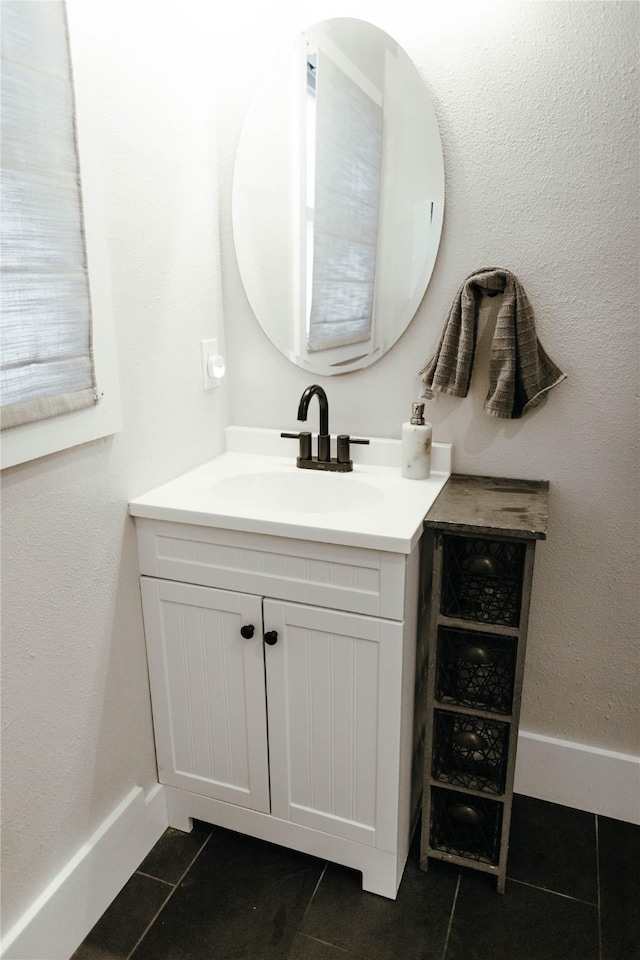 bathroom with vanity and tile patterned floors