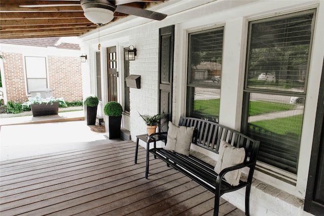 wooden deck featuring ceiling fan and a porch