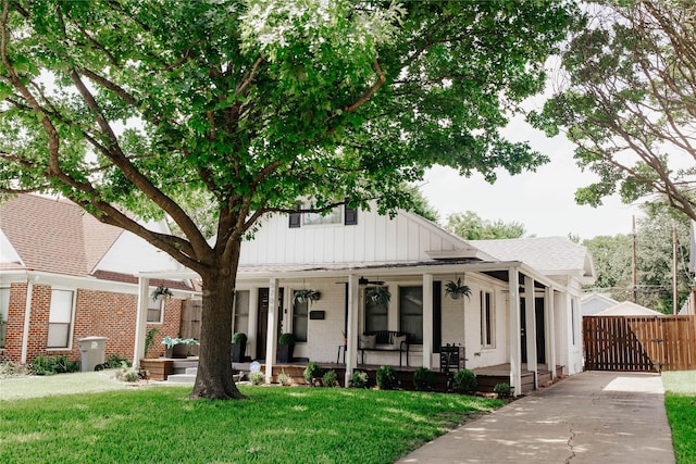 view of front of house featuring a front yard and covered porch