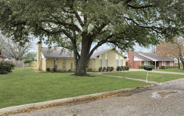 single story home featuring a front yard