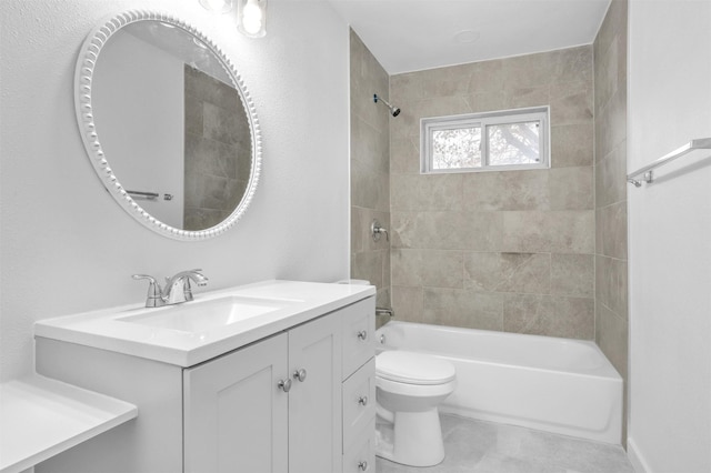 full bathroom with tiled shower / bath combo, vanity, and toilet