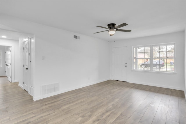 spare room with ceiling fan and light hardwood / wood-style floors