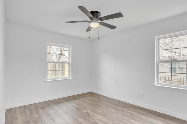 unfurnished room with ceiling fan and light hardwood / wood-style floors